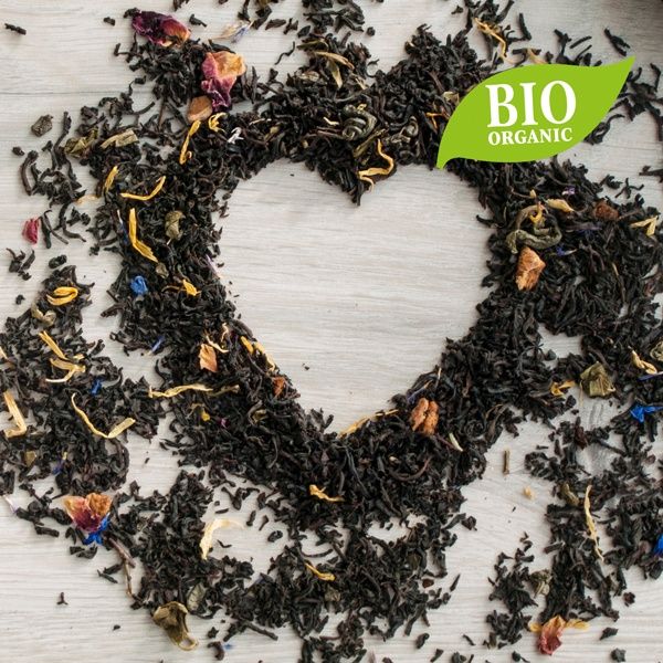 Loose tea in the shape of a heart with an organic flag